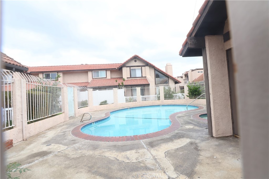 11547 Lower Azusa Road, Unit C El Monte, CA 91732 - Photo 3 of 4 a view of a house with a swimming pool