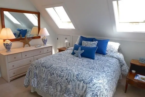 a bed room with a bed and a dresser