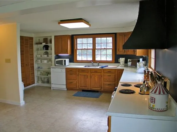 a kitchen with sink and cabinets