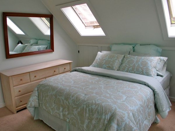 20 Katama Bay Road Edgartown, MA 02539 - Photo 32 of 40 a bedroom with a bed and a large window