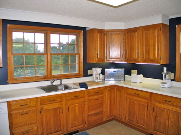 20 Katama Bay Road Edgartown, MA 02539 - Photo 33 of 40 a kitchen with stainless steel appliances granite countertop a sink and a window