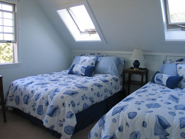 20 Katama Bay Road Edgartown, MA 02539 - Photo 35 of 40 a bed sitting in a bedroom next to a window