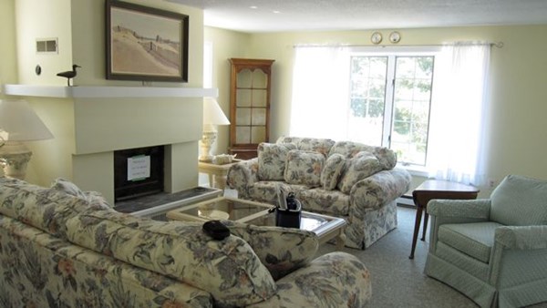 20 Katama Bay Road Edgartown, MA 02539 - Photo 37 of 40 a living room with furniture a flat screen tv and a fireplace