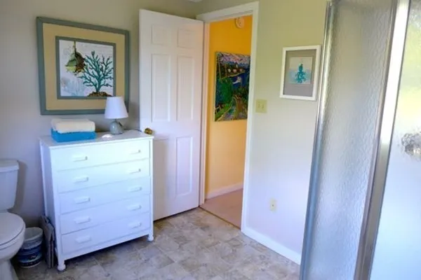 a view of room with closet and mirror