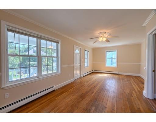 142 East Meadow Road Lowell, MA 01854 - Photo 17 of 28 a view of an empty room with a window and wooden floor