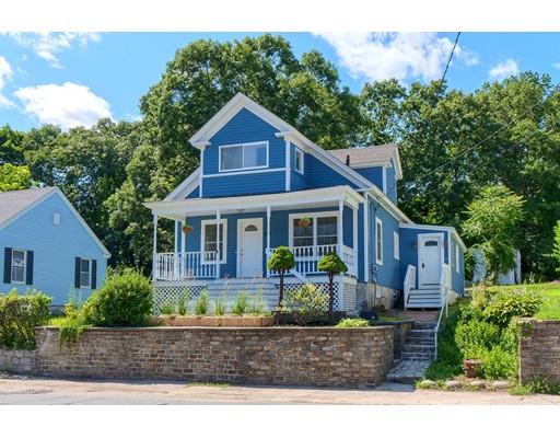 142 East Meadow Road Lowell, MA 01854 - Photo 2 of 28 a front view of a house with garden