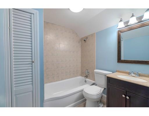 142 East Meadow Road Lowell, MA 01854 - Photo 21 of 28 a bathroom with a toilet a sink and a bathtub