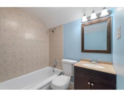 142 East Meadow Road Lowell, MA 01854 - Photo 22 of 28 a bathroom with a sink a toilet and mirror