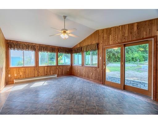 142 East Meadow Road Lowell, MA 01854 - Photo 8 of 28 a view of an empty room with wooden floor and a window