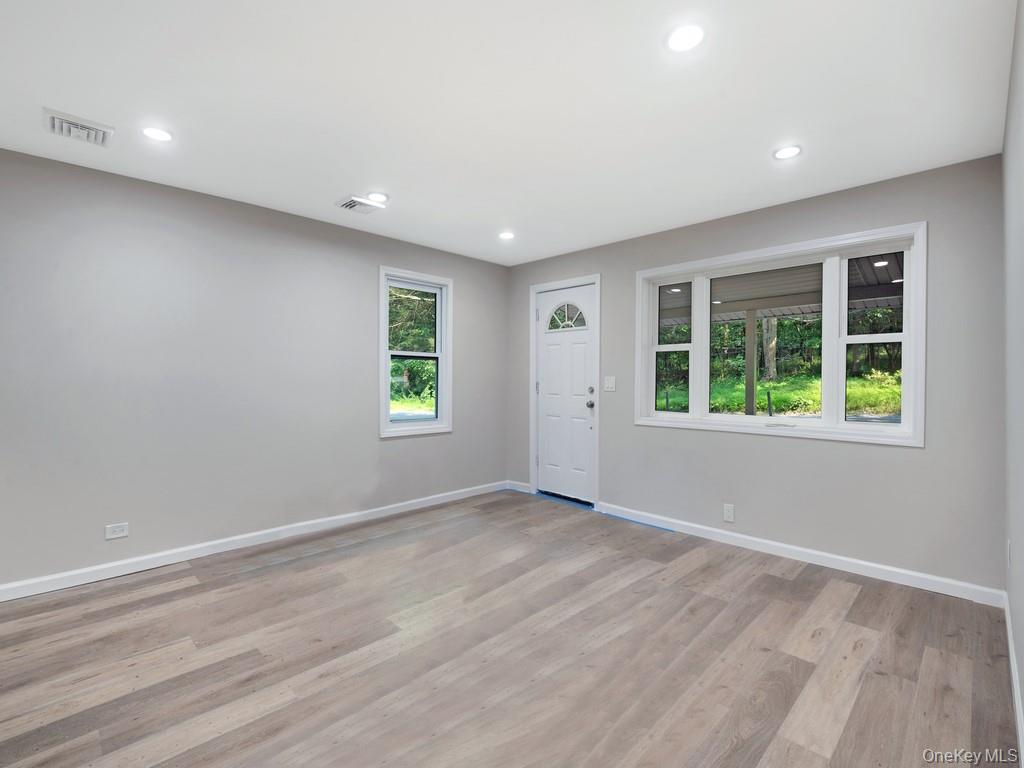 59 Corbin Road Dover Plains, NY 12522 - Photo 4 of 16 an empty room with windows