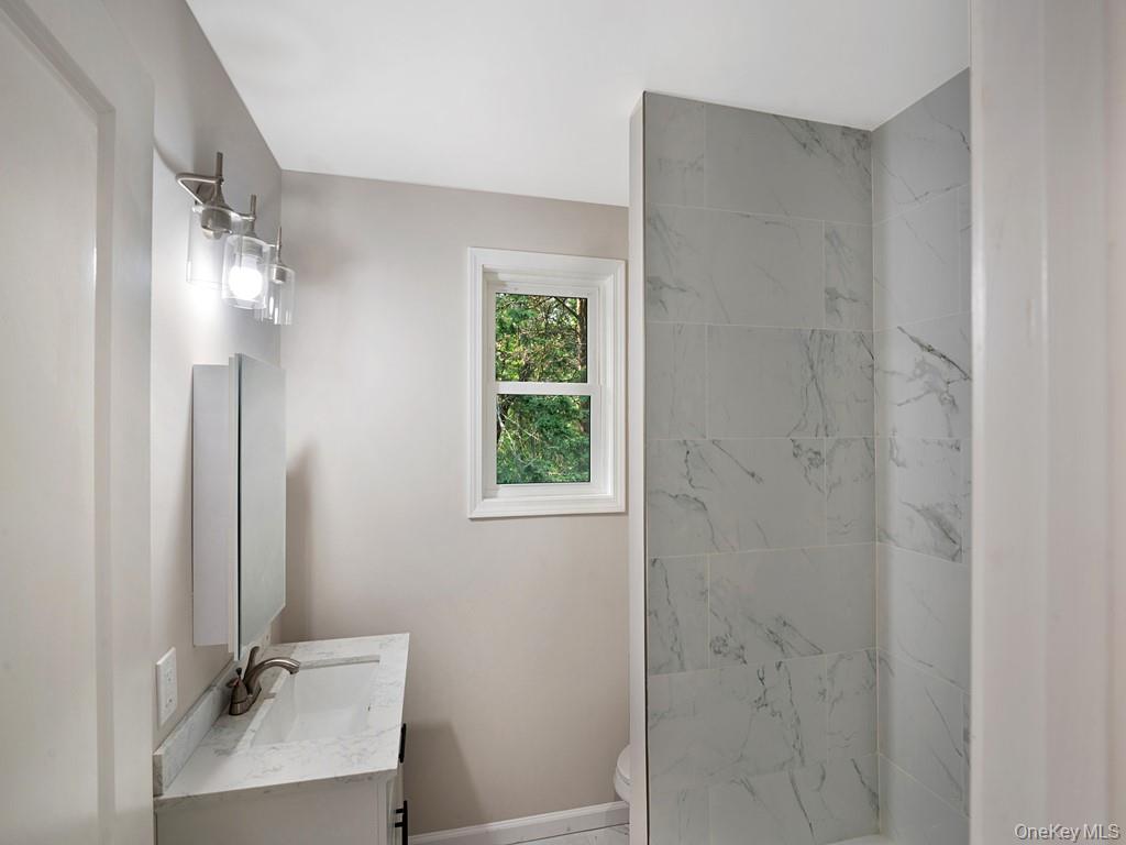 59 Corbin Road Dover Plains, NY 12522 - Photo 5 of 16 a bathroom with a sink a vanity and a mirror