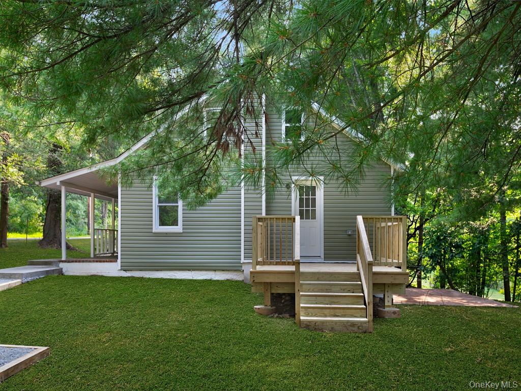 59 Corbin Road Dover Plains, NY 12522 - Photo 10 of 16 a view of a chair and table in the yard