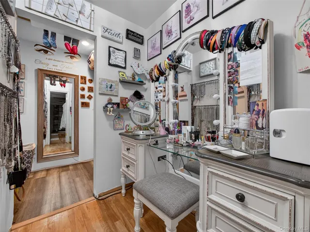 a kitchen with a refrigerator and a stove top oven