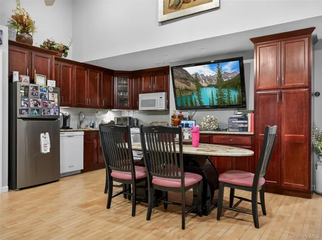 a dining room with furniture and window