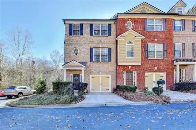 a front view of a house with garden
