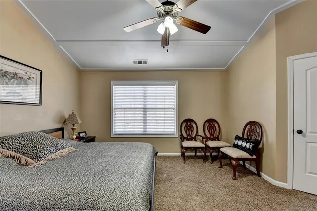 a bedroom with bed and a window