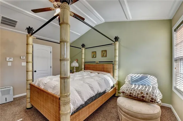 a bedroom with a bed and a couch