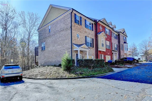 a view of a brick building next to a road
