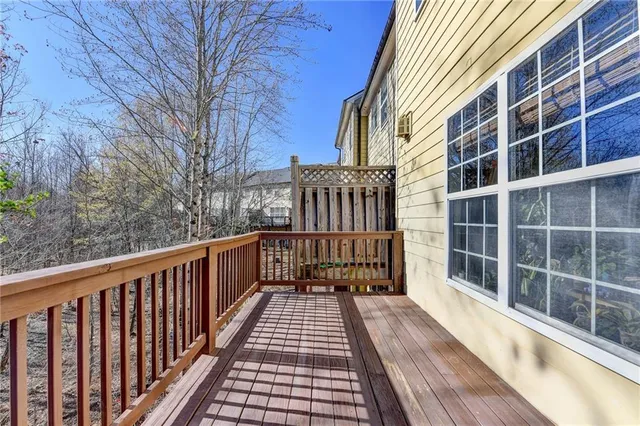 a view of a balcony with wooden floor