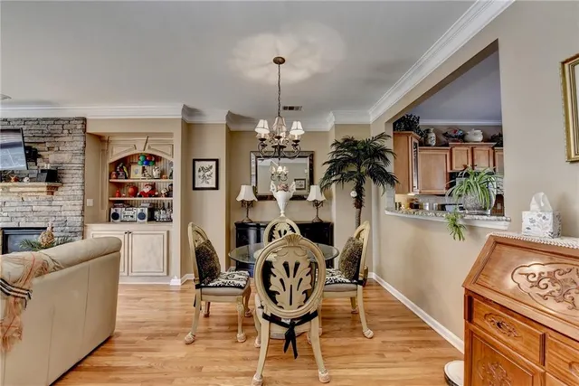 a view of a livingroom with furniture hardwood floor and a ceiling fan