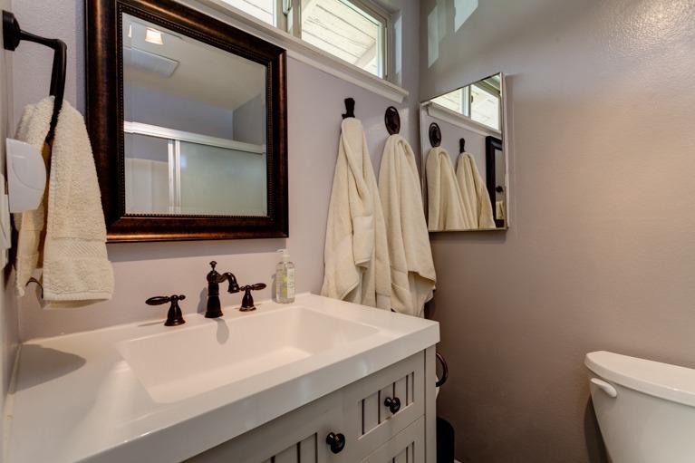 637 Thomas Street Oak View, CA 93022 - Photo 21 of 30 a bathroom with a sink a toilet and a mirror