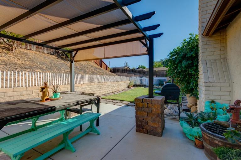637 Thomas Street Oak View, CA 93022 - Photo 23 of 30 a view of a patio with table and chairs potted plants with wooden floor