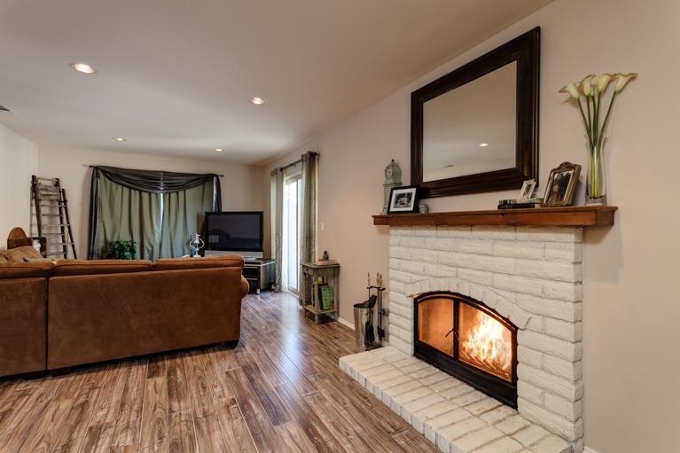 637 Thomas Street Oak View, CA 93022 - Photo 7 of 30 a living room with furniture a fireplace and a flat screen tv