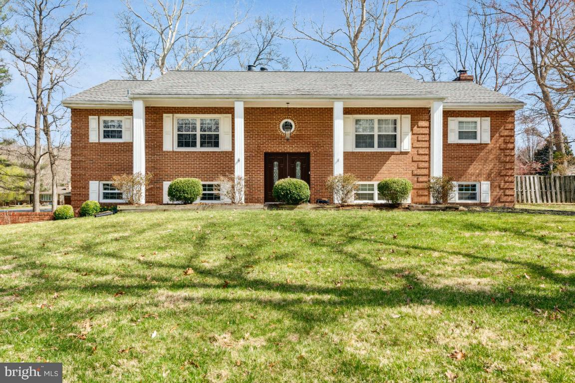 11213 Oakwood Drive Dunkirk, MD 20754 - Photo 1 of 48 a front view of a house with a yard
