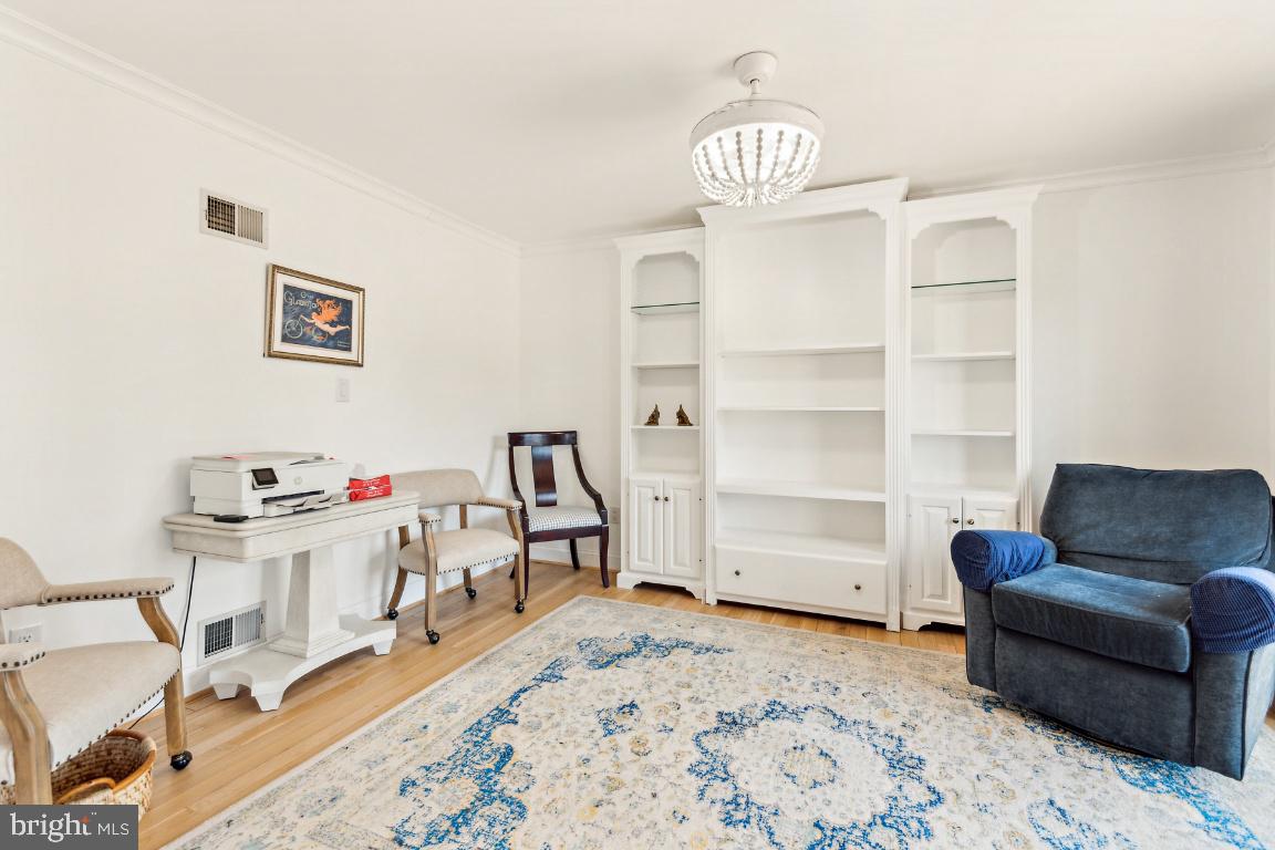 11213 Oakwood Drive Dunkirk, MD 20754 - Photo 19 of 48 a room with furniture and a flat screen tv