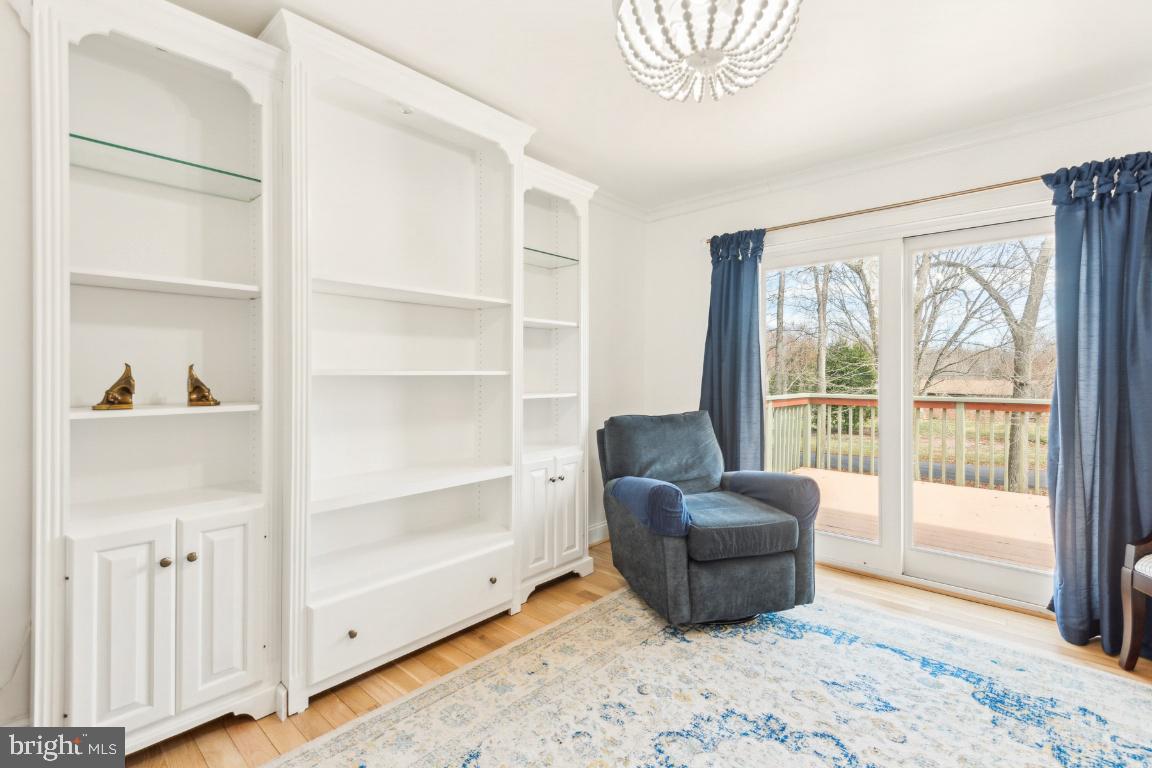 11213 Oakwood Drive Dunkirk, MD 20754 - Photo 20 of 48 a living room with furniture and a flat screen tv