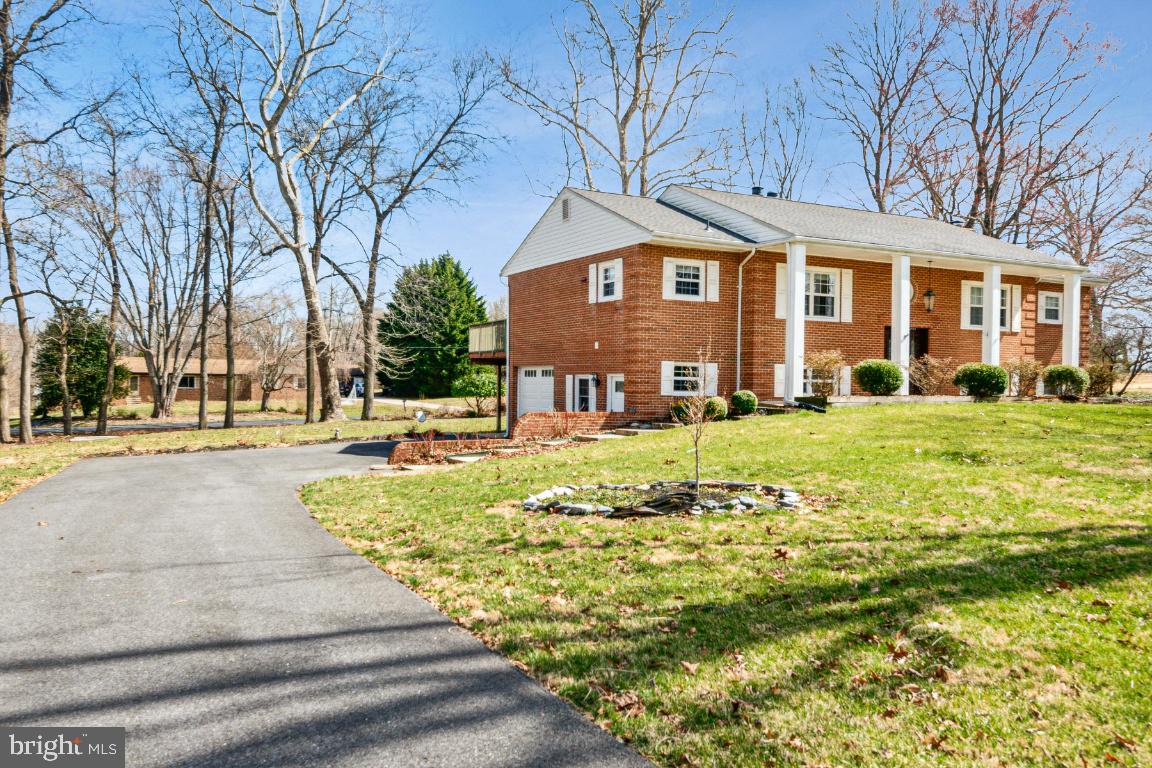 11213 Oakwood Drive Dunkirk, MD 20754 - Photo 2 of 48 a front view of a building with garden