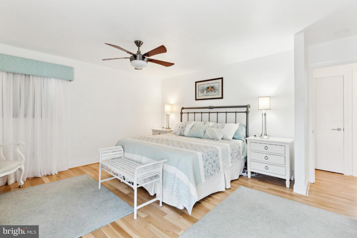 11213 Oakwood Drive Dunkirk, MD 20754 - Photo 22 of 48 a bedroom with a bed and a chandelier