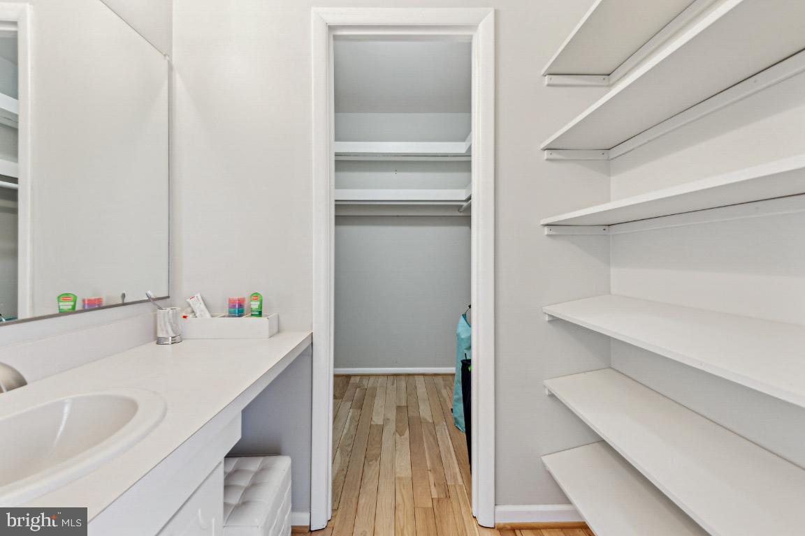 11213 Oakwood Drive Dunkirk, MD 20754 - Photo 25 of 48 a bathroom with a sink and a large mirror