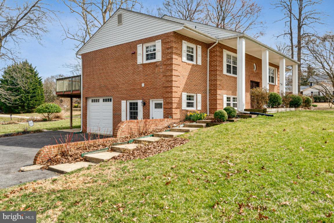 11213 Oakwood Drive Dunkirk, MD 20754 - Photo 3 of 48 a front view of a house with a yard
