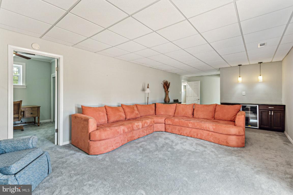 11213 Oakwood Drive Dunkirk, MD 20754 - Photo 33 of 48 a large living room with a couch
