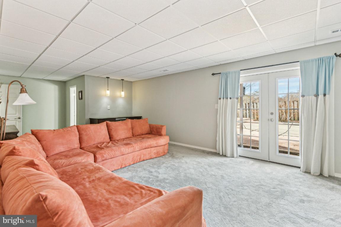 11213 Oakwood Drive Dunkirk, MD 20754 - Photo 34 of 48 a living room with a couch and a dresser