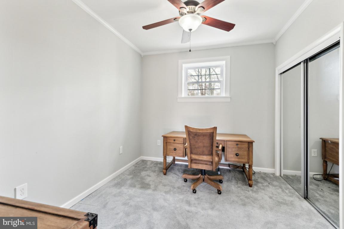 11213 Oakwood Drive Dunkirk, MD 20754 - Photo 36 of 48 a view of a workspace with furniture and a window