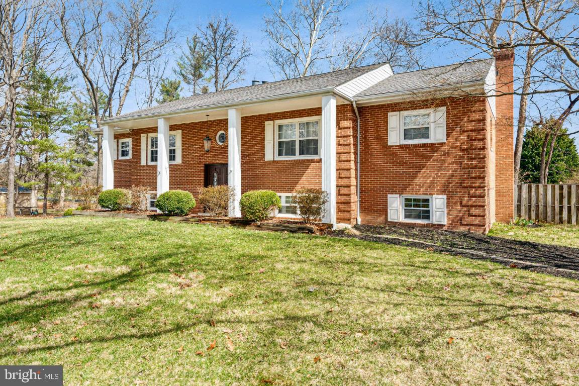 11213 Oakwood Drive Dunkirk, MD 20754 - Photo 4 of 48 a front view of a house with garden