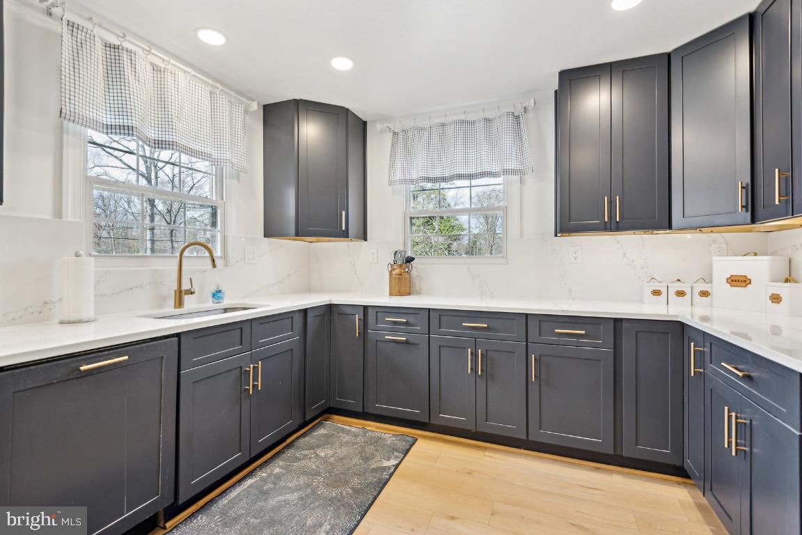 11213 Oakwood Drive Dunkirk, MD 20754 - Photo 10 of 48 a spacious bathroom with a sink double vanity and a mirror