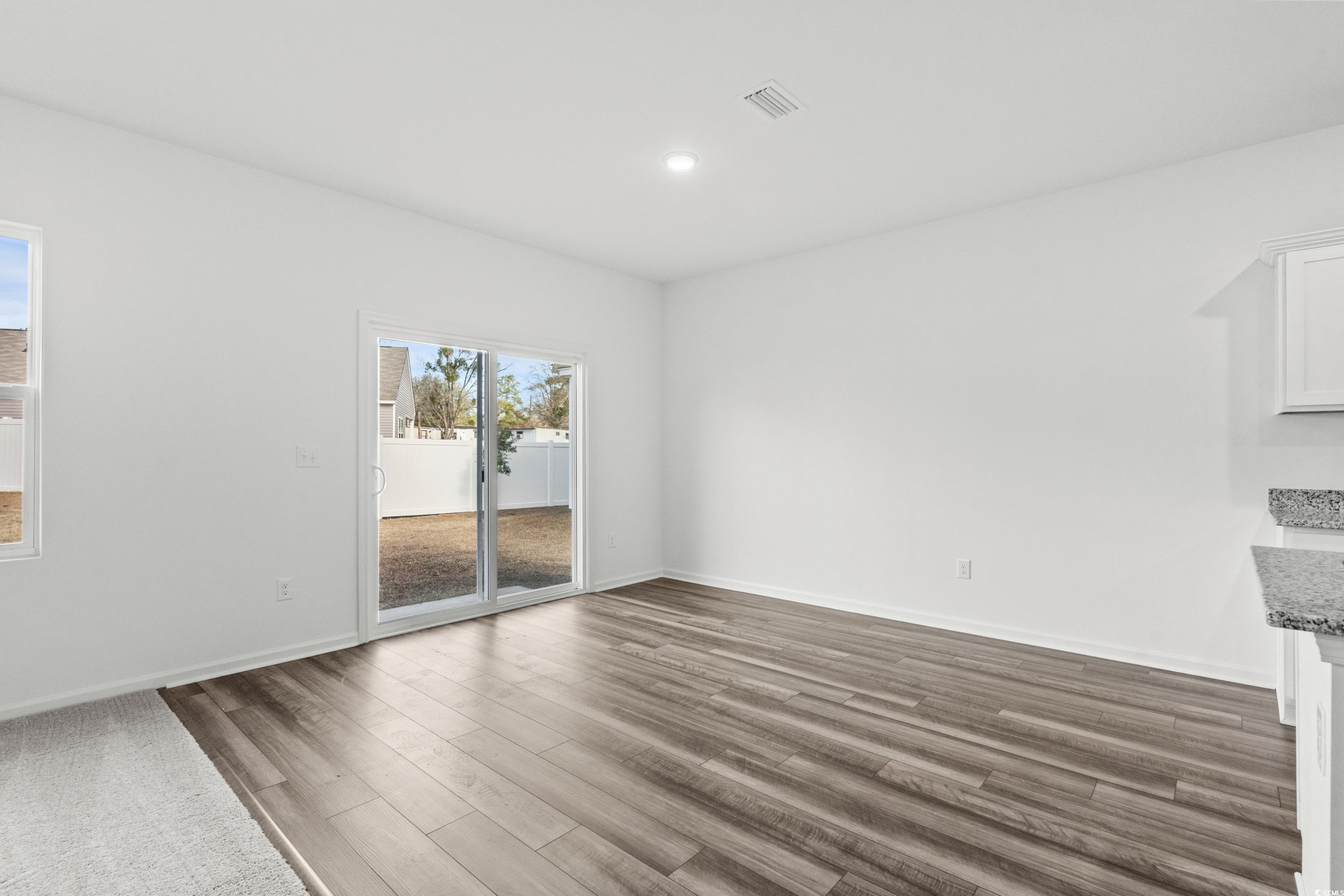 443 Castillo Drive Longs, SC 29568 - Photo 14 of 32 Unfurnished dining area featuring dark wood-style flooring and recessed lighting