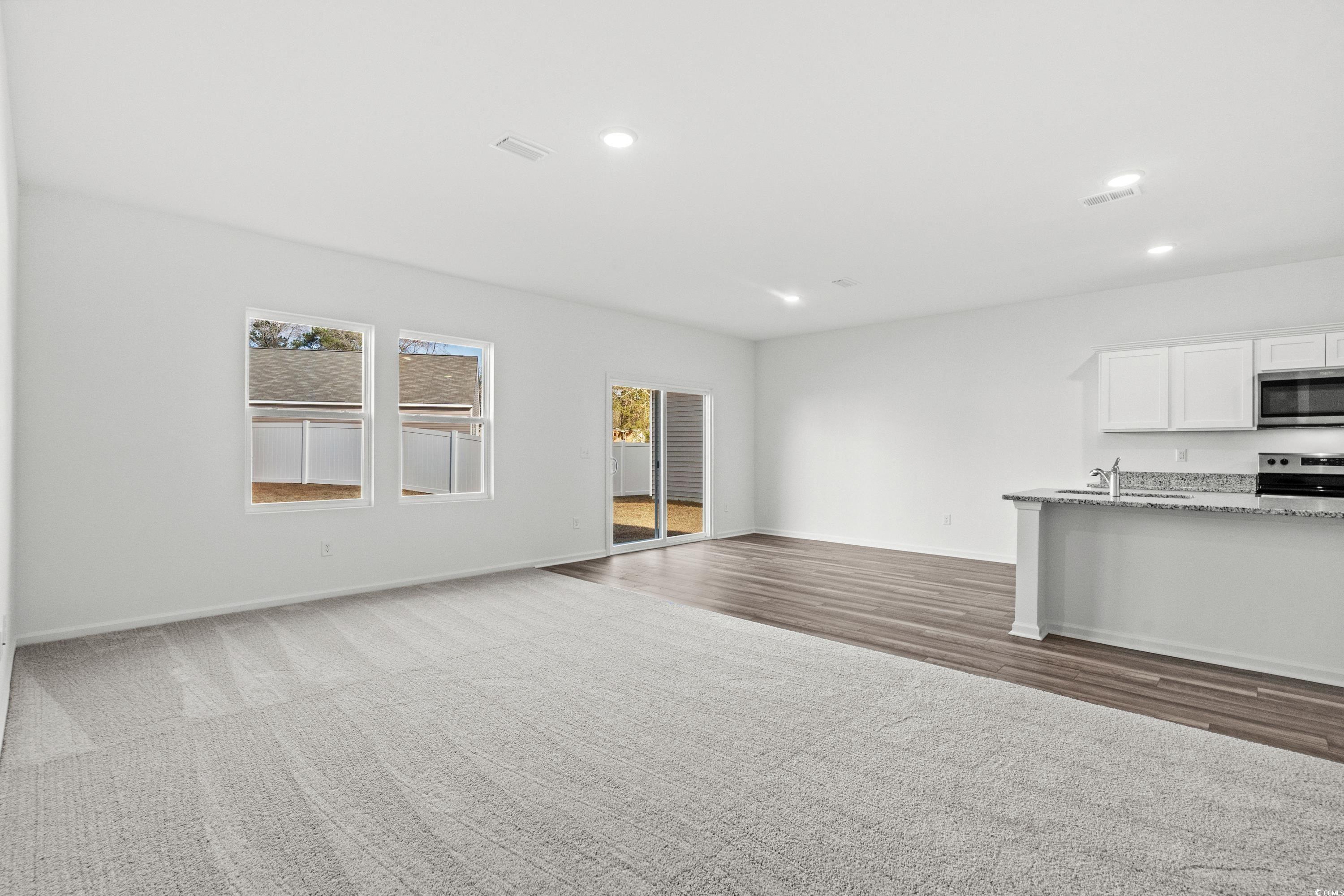 443 Castillo Drive Longs, SC 29568 - Photo 16 of 32 Unfurnished living room featuring baseboards and recessed lighting