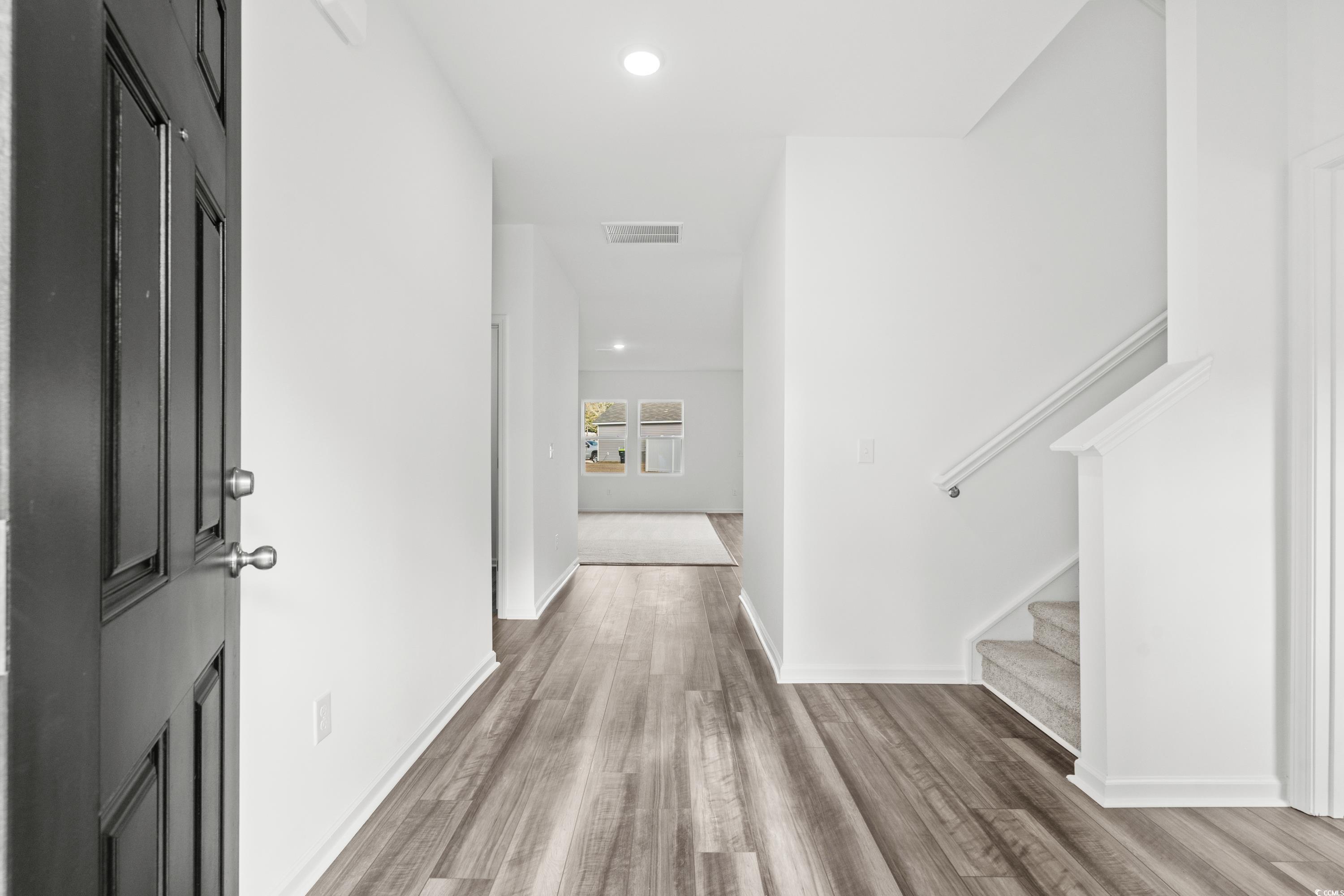 443 Castillo Drive Longs, SC 29568 - Photo 4 of 32 Hallway with stairs, recessed lighting, and light wood-style floors