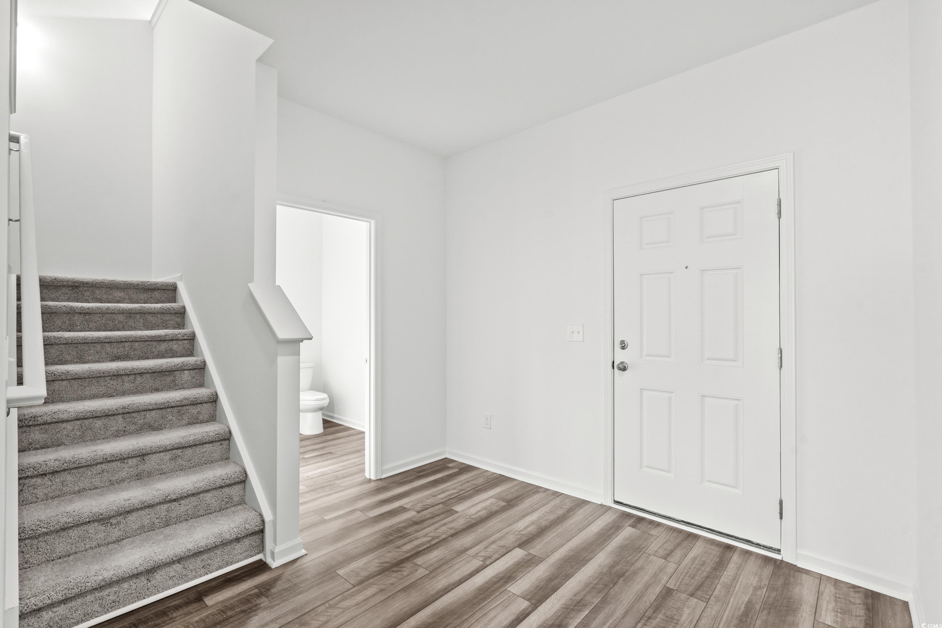 443 Castillo Drive Longs, SC 29568 - Photo 5 of 32 Entrance foyer featuring stairs and wood finished floors