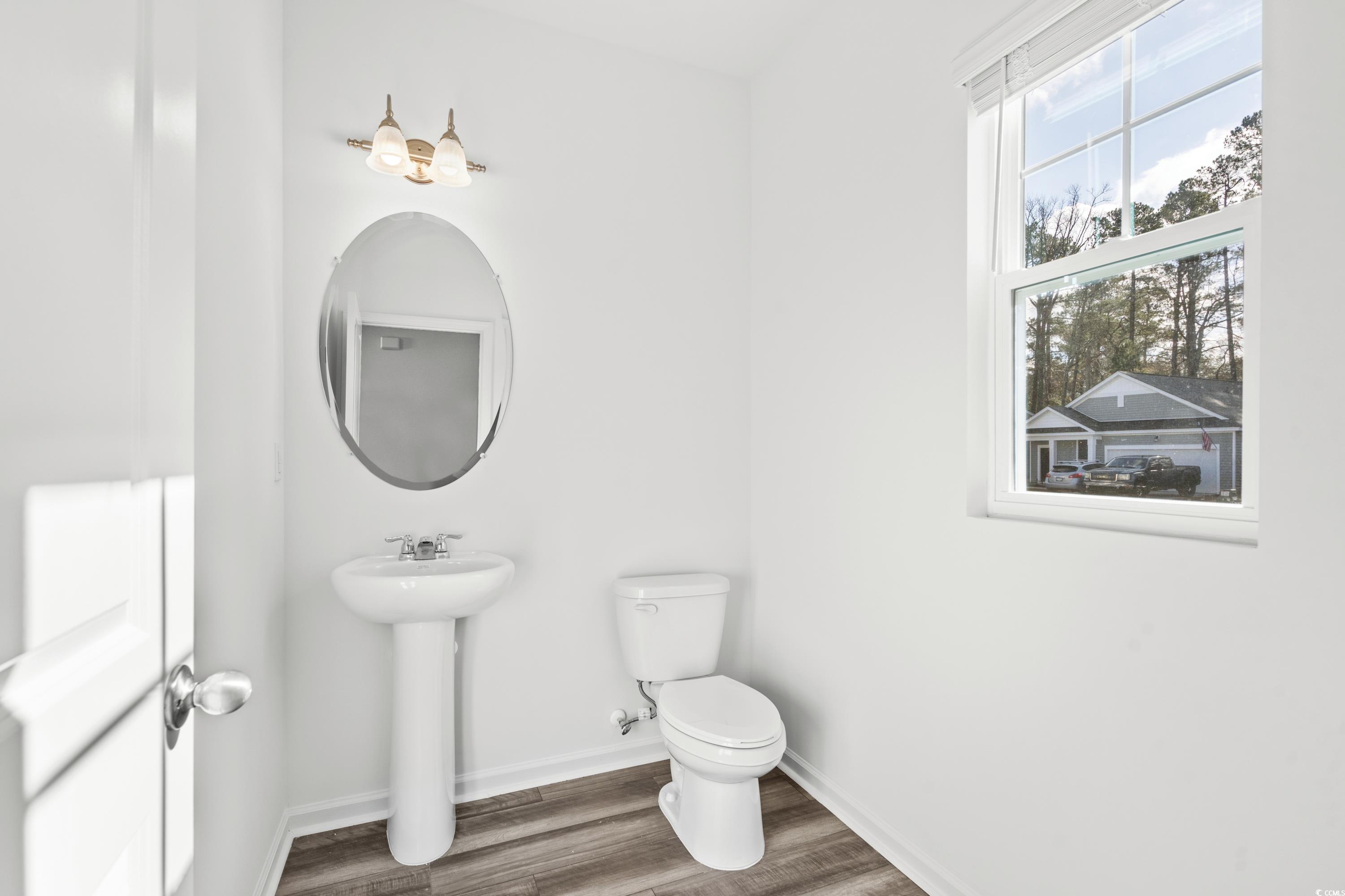 443 Castillo Drive Longs, SC 29568 - Photo 6 of 32 Half bathroom featuring toilet and wood finished floors