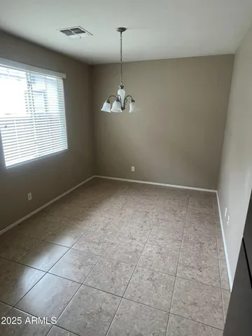 a kitchen with granite countertop a sink stove and cabinets