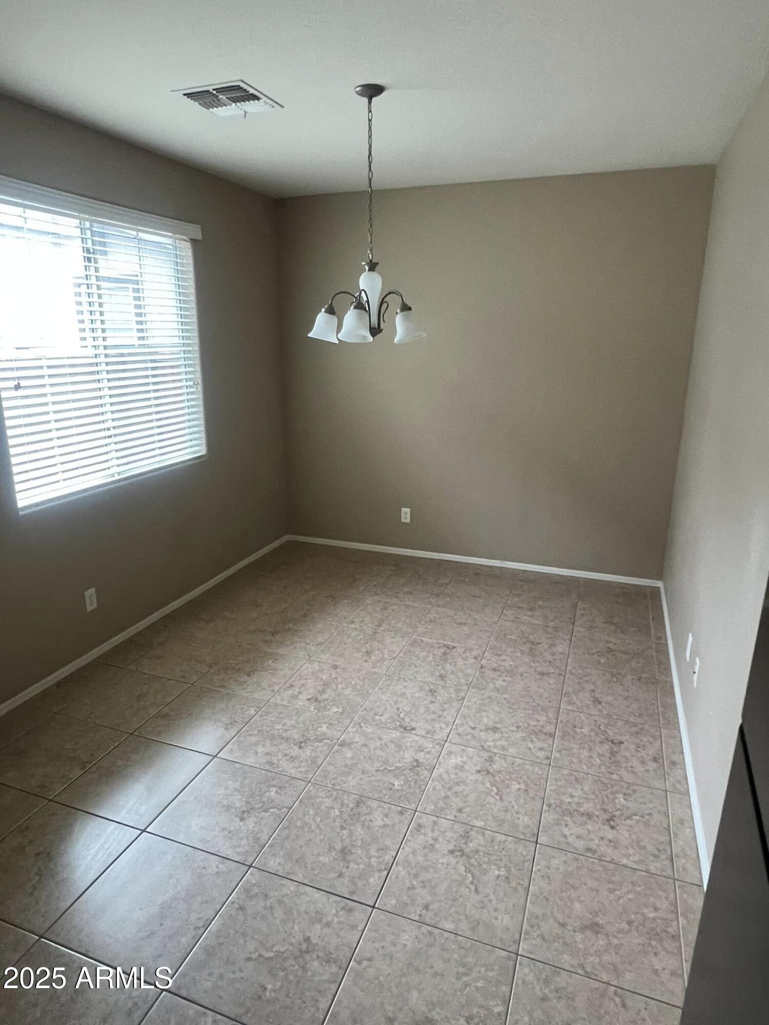 4265 East Milky Way Gilbert, AZ 85295 - Photo 14 of 33 en empty room with windows and ceiling fan