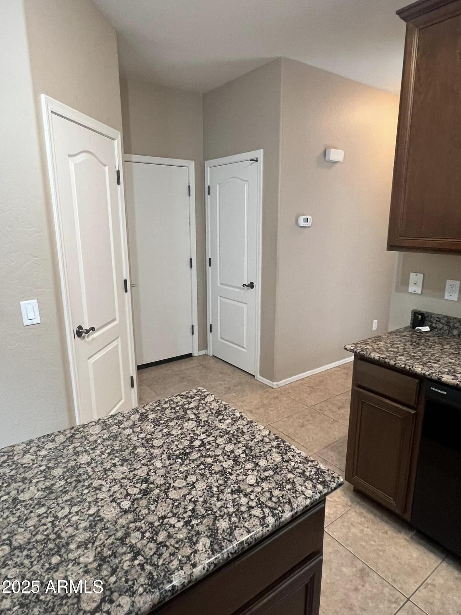 4265 East Milky Way Gilbert, AZ 85295 - Photo 16 of 33 a bathroom with a granite countertop sink a toilet and a mirror