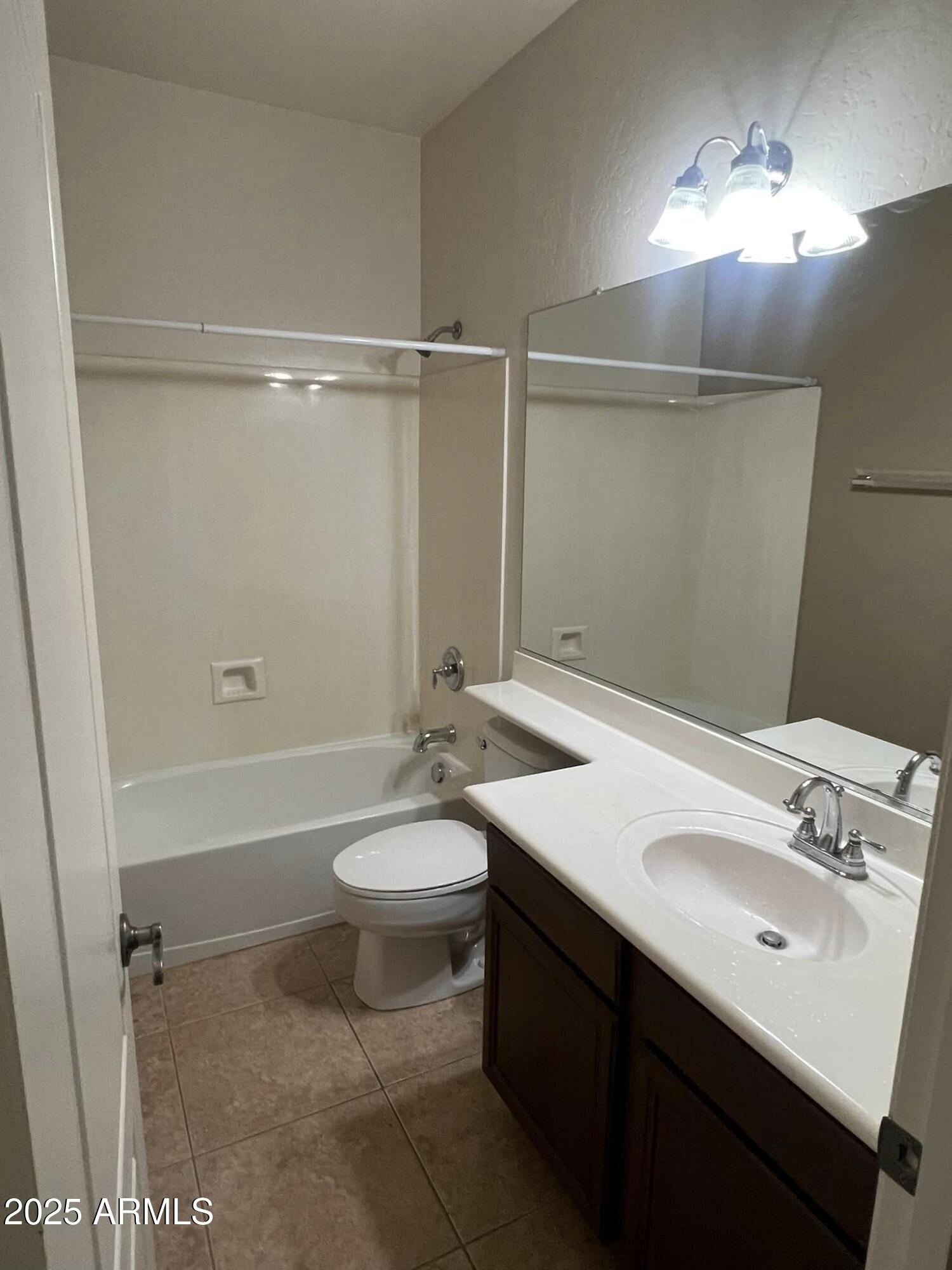 4265 East Milky Way Gilbert, AZ 85295 - Photo 23 of 33 a bathroom with a sink a toilet and shower