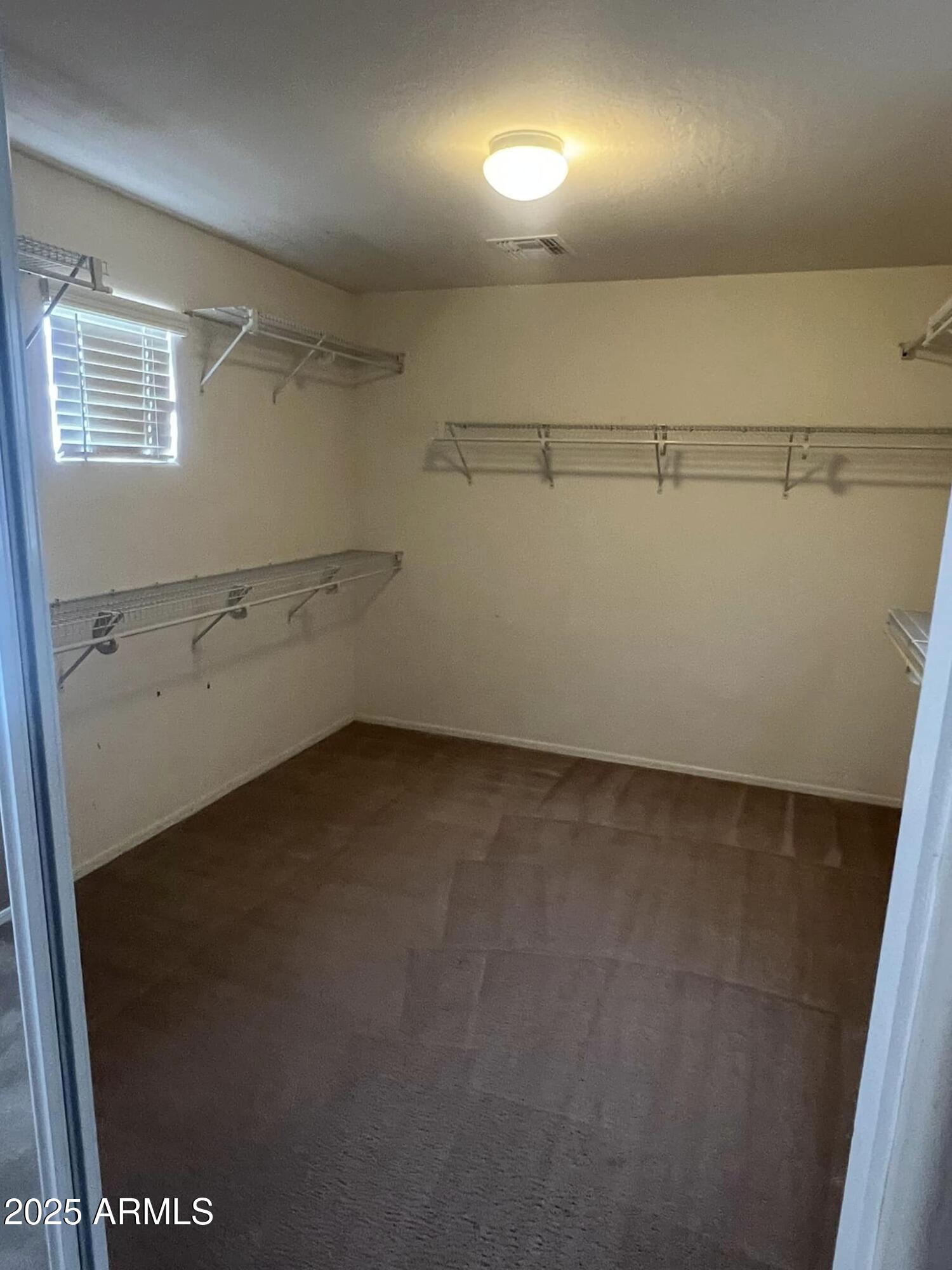 4265 East Milky Way Gilbert, AZ 85295 - Photo 27 of 33 a view of storage and utility room with racks on the wall