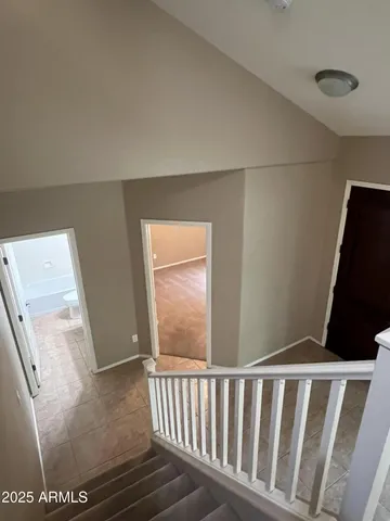 a white toilet sitting next to a window
